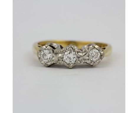 A hallmarked 18ct yellow and white gold diamond set ring, (M).