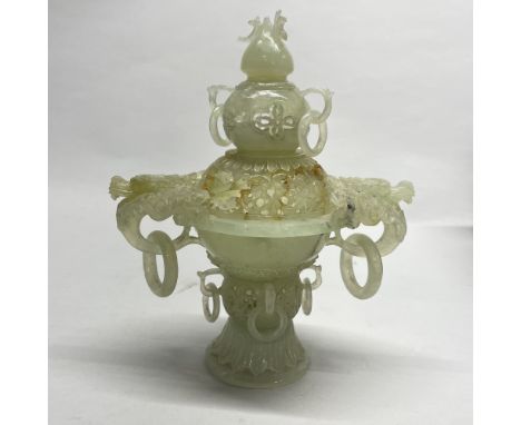 An intricately carved Chinese jade / hardstone censer with integral rings, H. 20cm, a/f to cover.