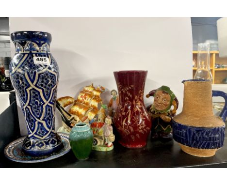 A hand painted pottery vase, H. 31cm with other ceramic items.