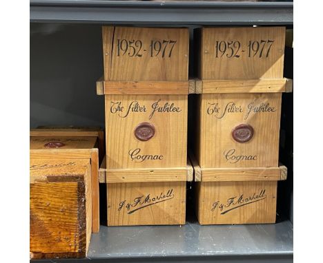 Three cased bottles of J&amp;J Martell silver jubilee cognac, one case with alcohol leakage ( possibly from another bottle wh