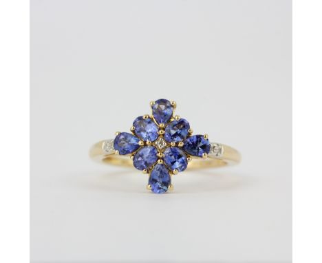 A 14ct yellow gold ring set with cornflower blue sapphires and diamonds, (O.5).