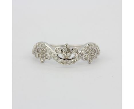 A hallmarked 9ct white gold (marked 10K) diamond set ring, (N.5).