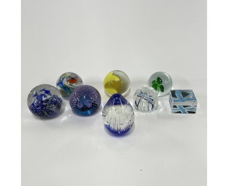 A group of eight paperweights, including a Caithness 'Cauldron Aqua'. H. 9cm.