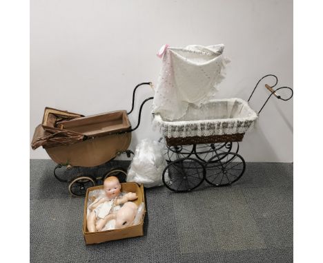 Two vintage prams together with an A. M German bisque porcelain doll 351/6.K. Largest pram 88 x 75cm.
