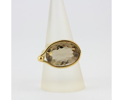 A boxed hallmarked Georg Jensen 18ct yellow gold ring set with a large oval cut citrine, (Q).