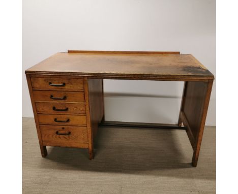 A light oak five drawer writing desk, 120 x 73 x 60cm.