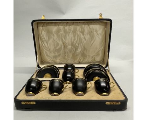 A cased Royal Worcester coffee set, one saucer damaged.