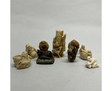 A group of Chinese bone, resin and tagua nut figures and netsuke, tallest H. 7cm.