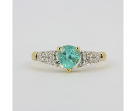 A hallmarked 18ct yellow gold ring set with a pear cut paraiba tourmaline and diamond shoulders, (O.5).