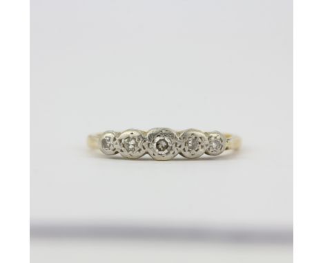 A yellow and white metal (tested minimum 9ct gold) diamond set ring, (M).