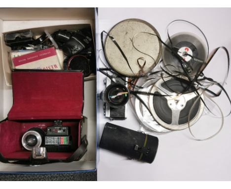 A Minolta camera with lenses and other equipment.