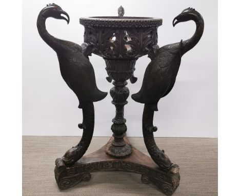 A superb 19thC carved hardwood planter holder, with repair to neck, H. 90cm bowl Dia. 40cm base W. 70cm.