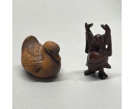 A carved wooden Chinese figure of Putai, together with a carved fruitwood netsuke of a duck, with signature to base, tallest 