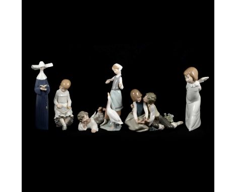 Eleven Lladro and Nao figurines, including seven Lladro models of Nuns, an Angel, Boy and Girl couple, and four Nao figurines