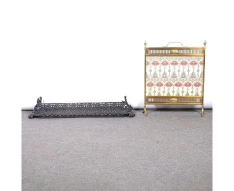 Pierced and cast iron fire curb, length 102cm, and an Arts and Crafts brass firescreen with a cloth panel.Qty: 2