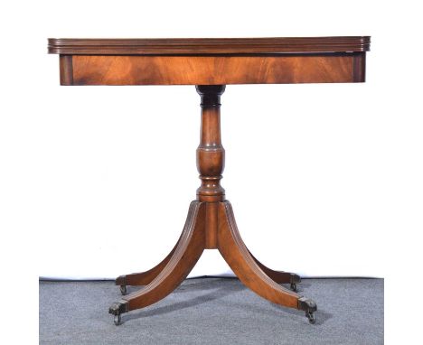 Regency style mahogany card table, foldover with with baize interior, turned column, moulded splayed legs on casters, width 8