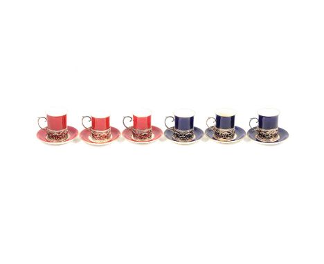 Set of six coffee cans in silver holders, retailed by George Jones, three burgundy, three navy, the holders hallmarked W.M Co