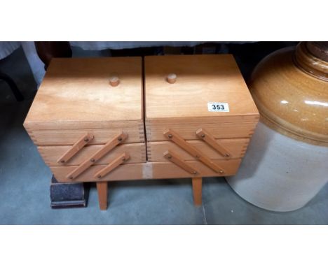 A vintage cantilever sewing box which contains a large lot of lace bobbins etc COLLECT ONLY