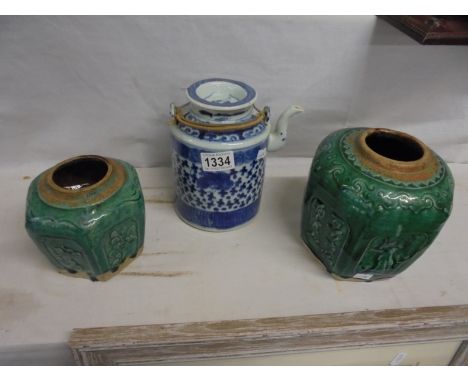 Two Chinese green ceramic pots and a Chinese blue and white teapot.Teapot has chip to spout.No visible damage to other items