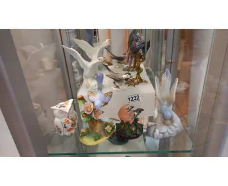 A Lladro swan and other bird figures including Goebel and Ainsley.