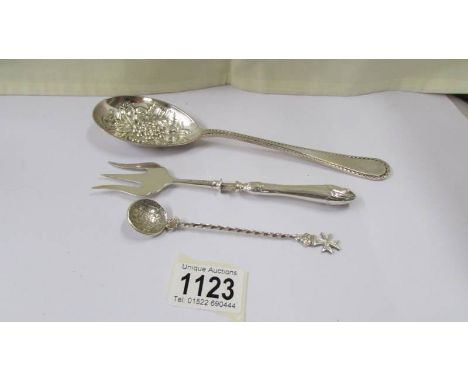 A silver fruit spoons, 2.6 ounces, a spoon with coin bowl and a silver handled pickle fork.