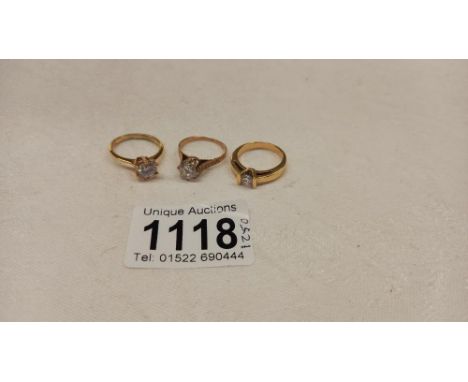 A 9ct gold ring size M half, 2.2 grams and two un-marked yellow metal rings, sizes M half and O.