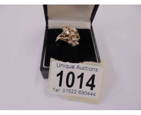 A white gold large floral diamond ring, size N half, 5.4 grams/