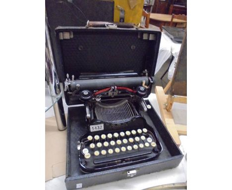 An early 20th century cased Corona Special typewriter.