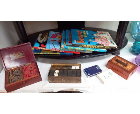 An early mahogany boxed Bezique card game with inlaid folding cribbage board, cards, tin dominoes and selection of children's