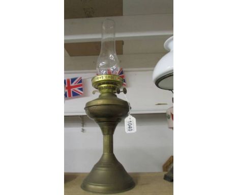 A brass 'Half Nelson' oil lamp with chimney. COLLECT ONLY.