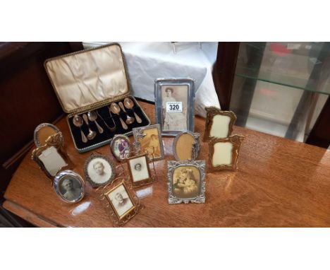A selection of vintage picture frames including art deco style and a cased set of teaspoons