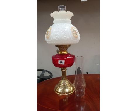 A Victorian style oil lamp with ruby glass font COLLECT ONLY
