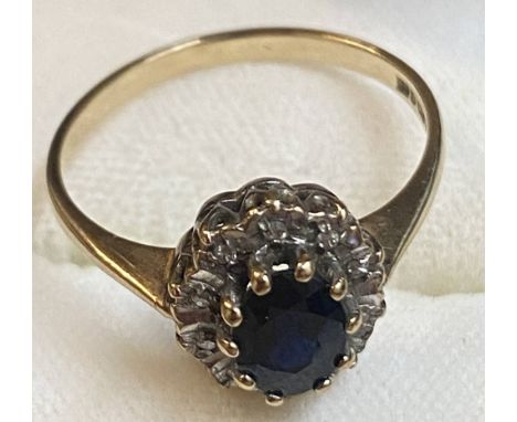 A 9ct Gold Sapphire and Diamond ring (the diamonds being chip surmounted to ring) Ring size is N 1/2 