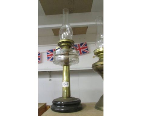 An old oil lamp on pot base with brass column, glass font and chimney, COLLECT ONLY.