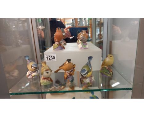Seven Royal Worcester bird figures.