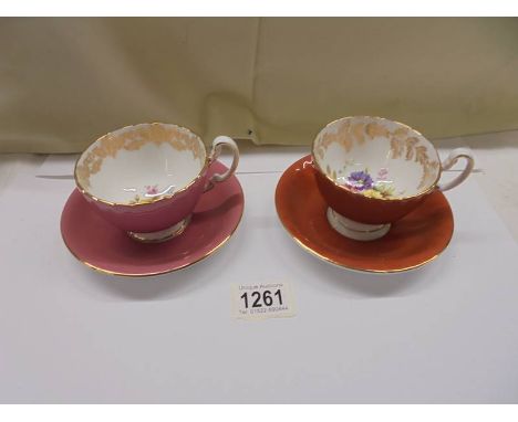 A pair of Aynsley floral tea cups and saucers.