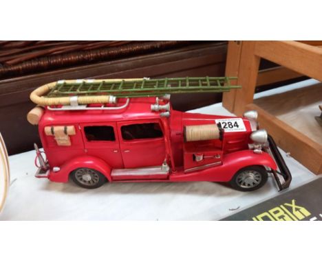 A large pressed steel and fibre glass model of a vintage American fire engine length 36cm