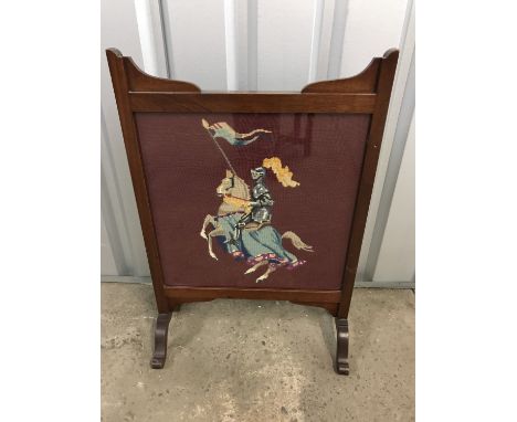 A mahogany framed tapestry fire screen embroidered with St George