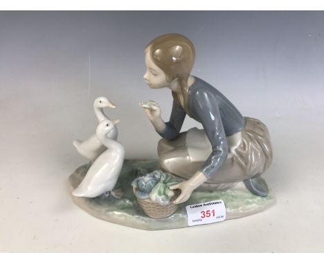 A Lladro figurine of a girl with geese