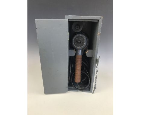 A Second World War British military signalling lamp in wooden transit case