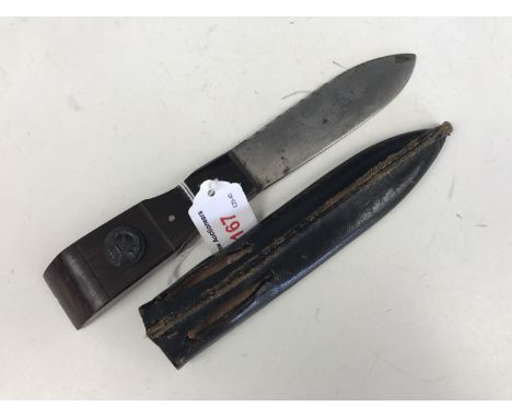 A small rosewood handled knife / sgian dubh bearing a Victorian light infantry button 
