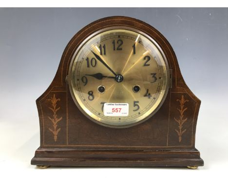 A brass-faced mahogany mantle clock 