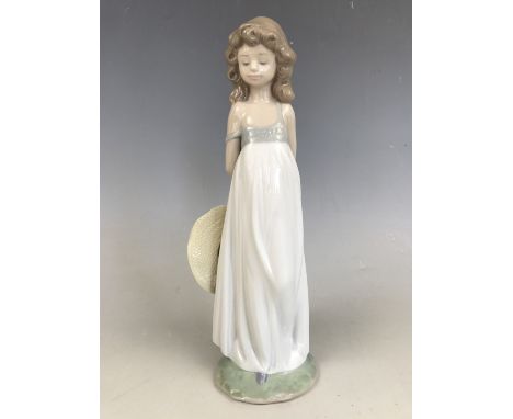 A Lladro figurine of a girl with hat, 6B56B - 2005 Events Creation