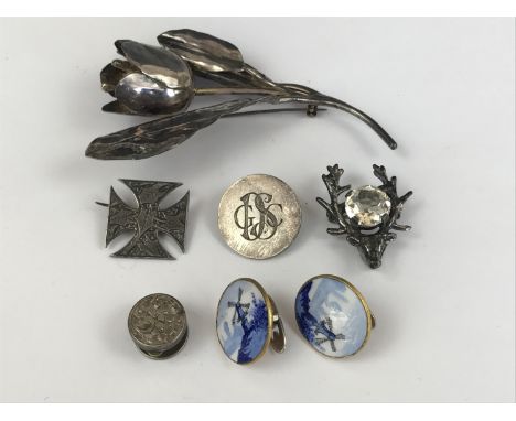 Vintage jewellery including a large white-metal tulip brooch stamped 'Sterling', a late Victorian white metal brooch, a white