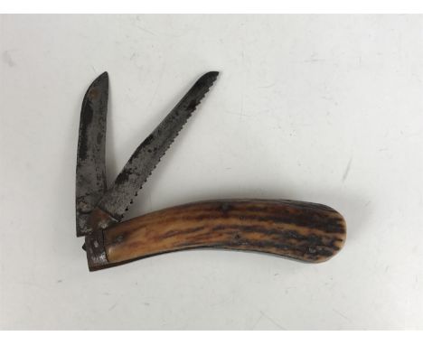 A Victorian folding pocket knife with saw blade by Harrison Brothers and Howson