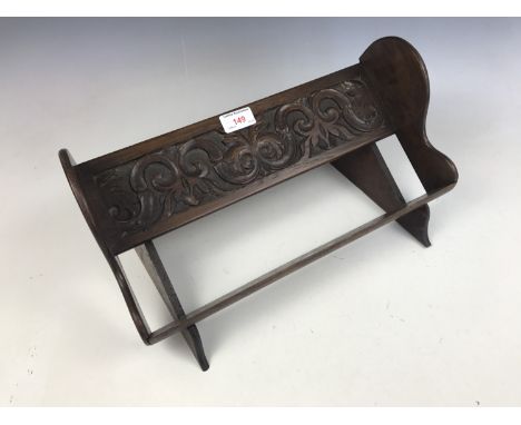 A diminutive carved oak book trough 