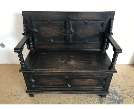 A 1920s oak 'monks' bench