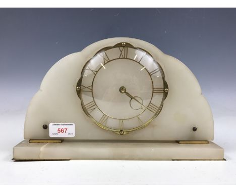 A 1950s alabaster mantel clock