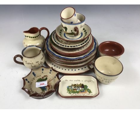 A quantity of Torquay ware including plates, teapot stands and cups etc.
