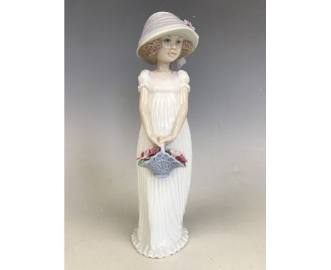 A Lladro figurine of a girl with basket of flowers, VO3P3 - 2004 Events Creation